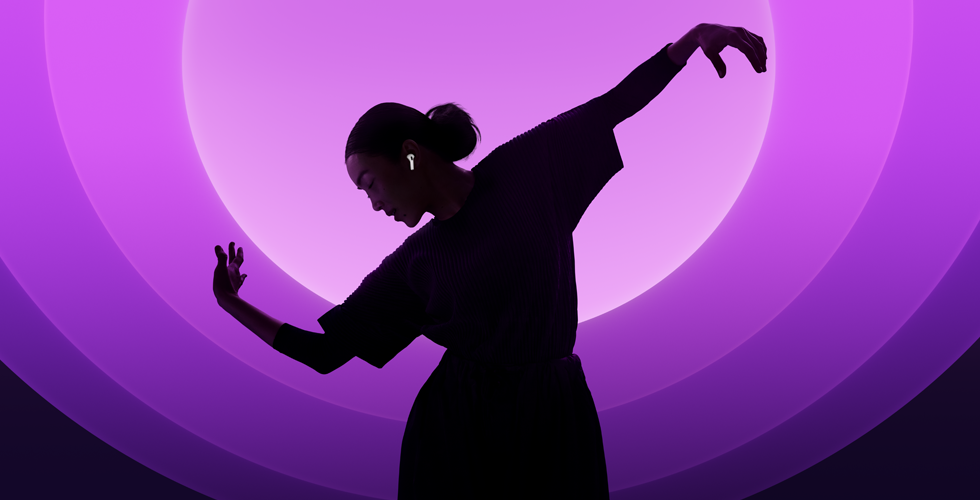 A person dancing while wearing AirPods 5, multi-colour background