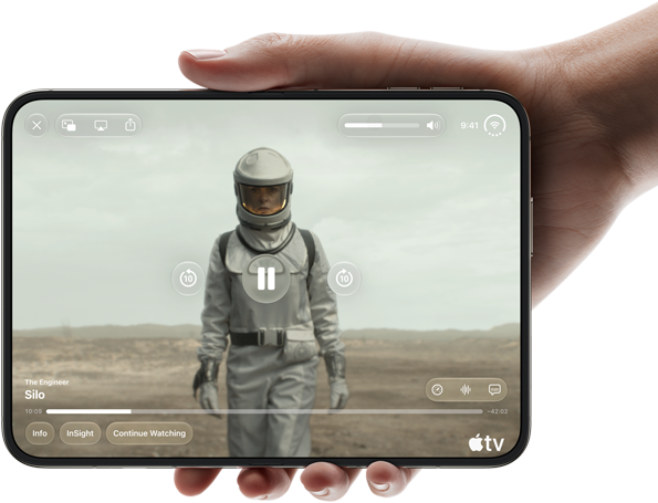 iPhone&nbsp;Duo, held with one hand, opened in horizontal orientation, fully unfolded, interior screen displays Apple&nbsp;TV show &ldquo;Silo&rdquo;